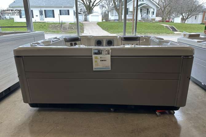 A bullfrog A6L spa being showcased from a front facing view in a showroom.