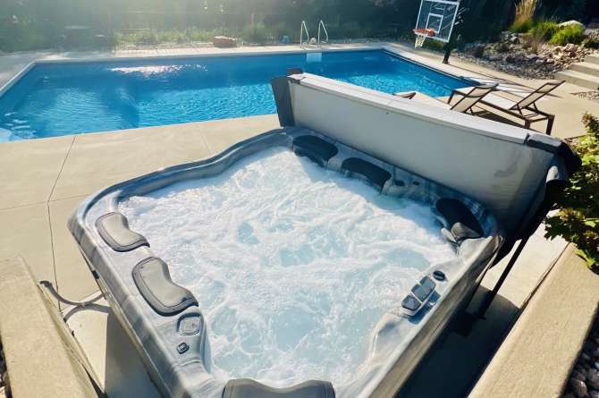 Bullfrog Spas A8 Series outdoors in a natural setting.