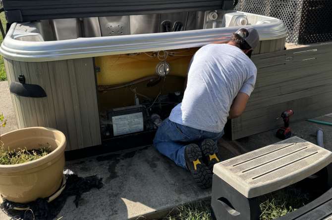 Brad conducting a hot tub repair.