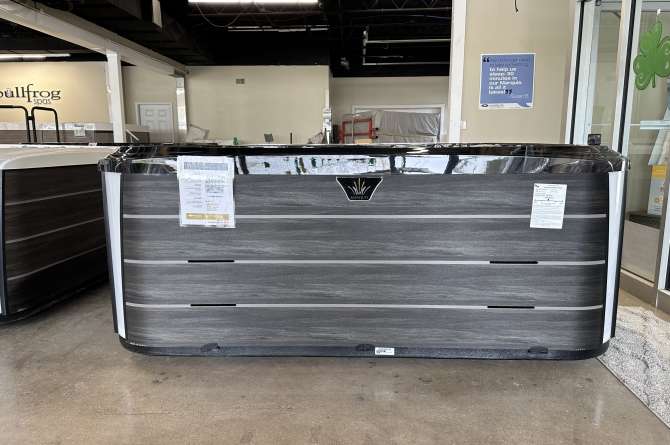 A Crown series spa in an indoor showroom.