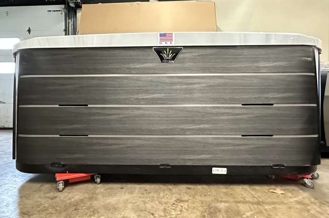 A Crown series spa in an indoor showroom.