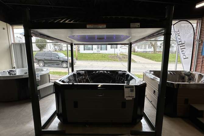 A Vector 21 series spa with a natural light view.