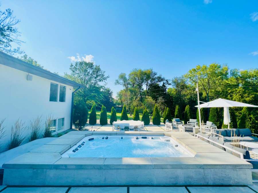 A Marquise ATV spa being showcased outdoors on a sunny day.