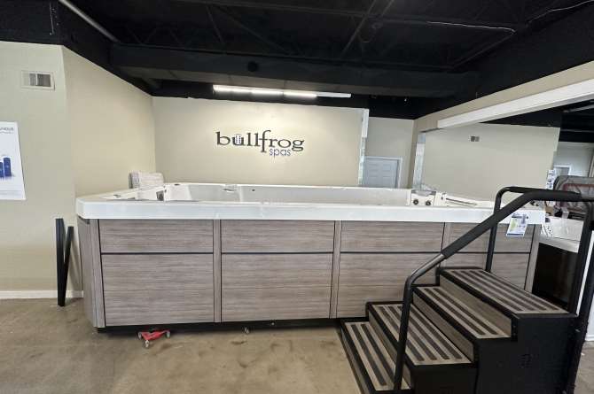 Bullfrog S200 Spa front facing view in a showroom.