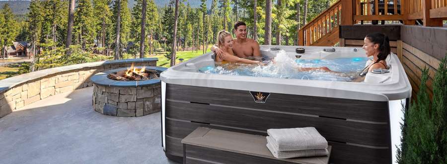 A group of friends enjoying time in their crown collection hot tub.