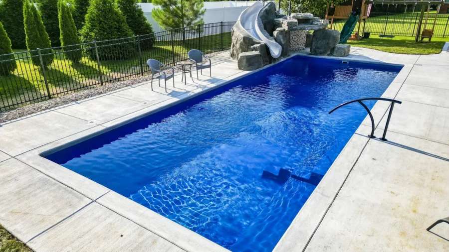 The imagine celebration pool showcasing brilliant blue water and a slide.